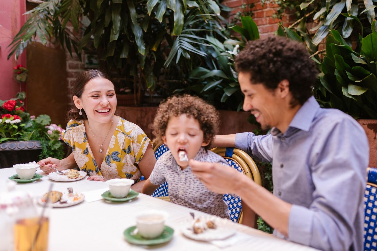 Family enjoying a satisfying dining experience at a restaurant together